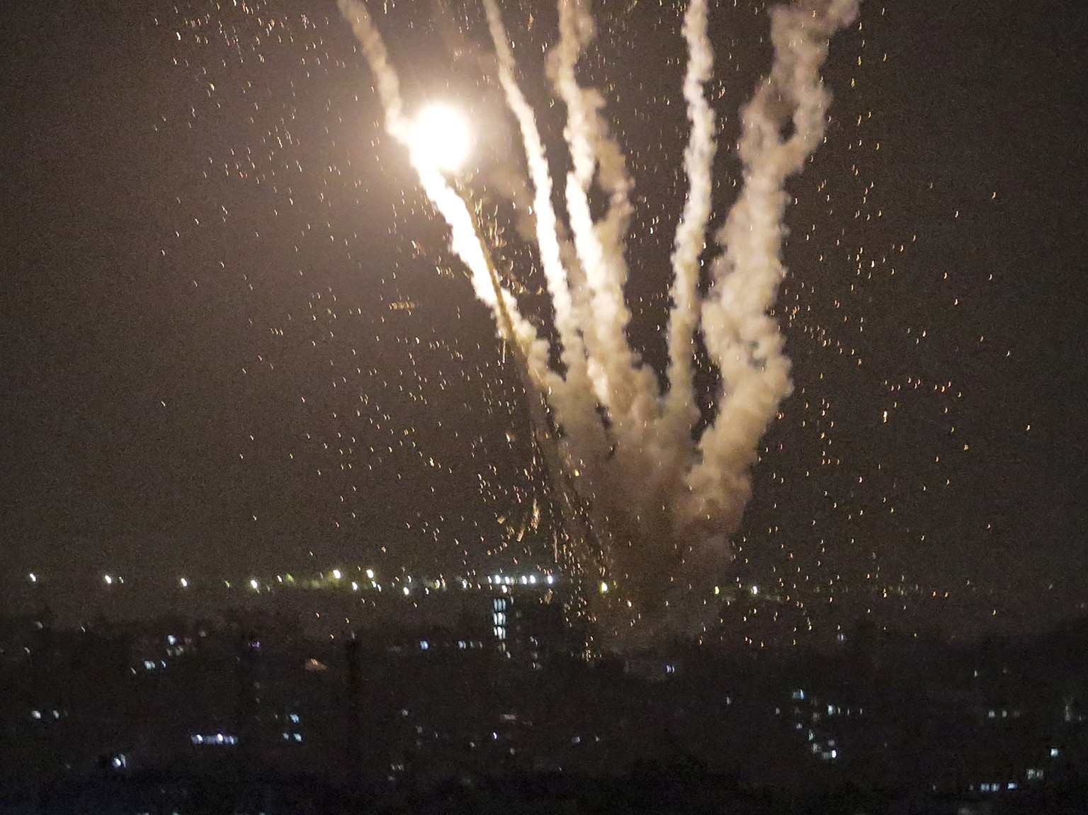 epa10620009 Rockets are fired by fighters of the Al-Quds Brigades, the armed wing of the Palestinian Islamic Jihad in eastern Gaza City, May 10, 2023. Palestinian militants in Gaza have fired rockets...