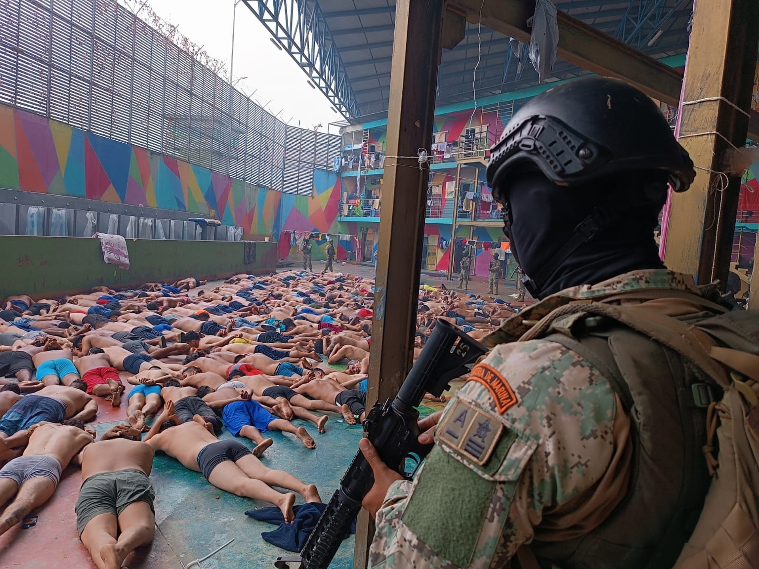 epa11065100 A handout photo made available by the Armed Forces of Ecuador shows Marine Infantry soldiers as they carry out an operation after a riot at the Litoral Regional Prison in Guayaquil, Ecuado ...