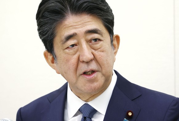 Former Japanese Prime Minister Shinzo Abe speaks during a press conference in Tokyo, Thursday, Dec. 24, 2020. Abe offered his deep apologizes on Thursday over illegal expenses linked to a dinner party ...