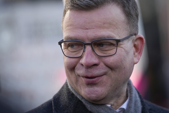 Chairman of the National Coalition Party Petteri Orpo smiles as he meets supporters during a campaign rally in Espoo, Finland, Saturday, April 1, 2023. A parliamentary election in Finland on Sunday is ...