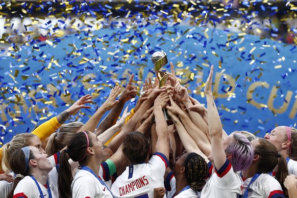 epa07701908 The USA team celebrate after winning the FIFA Women&#039;s World Cup 2019 final soccer match between USA and Netherlands in Lyon, France, 07 July 2019. EPA/IAN LANGSDON