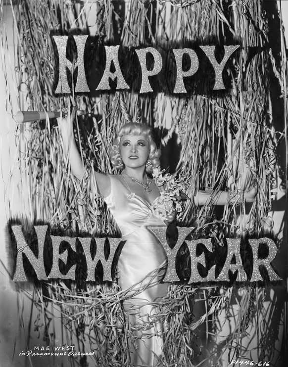 1936: New Year&#039;s Eve
Actress Mae West poses for the camera in her usual glitz and glam. Years later, she released a holiday album titled Wild Christmas, featuring the song &quot;My New Year&#039; ...