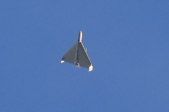 FILE - An Iranian Shahed exploding drone launched by Russia flies through the sky seconds before it struck buildings in Kyiv, Ukraine, on Oct. 17, 2022. (AP Photo/Efrem Lukatsky, File)