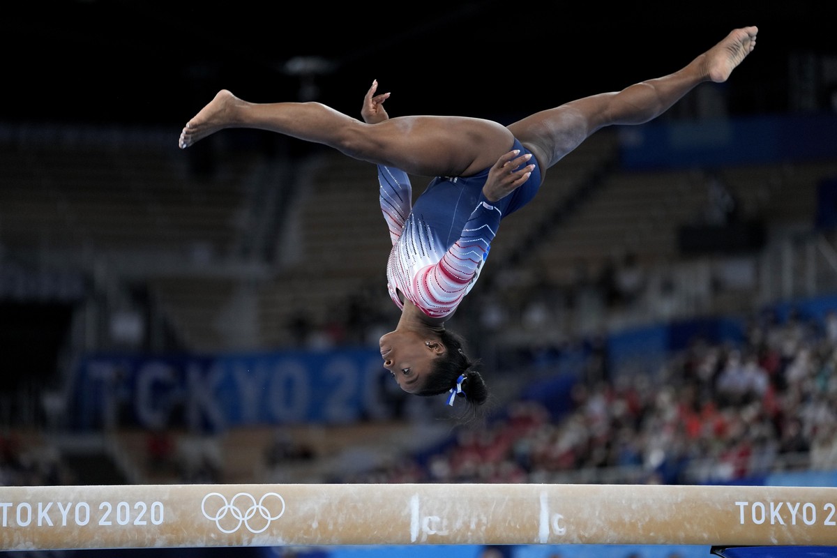 Simone Biles, of the United States, performs on the balance beam during the artistic gymnastics women's apparatus final at the 2020 Summer Olympics, Tuesday, Aug. 3, 2021, in Tokyo, Japan. (AP Ph ...