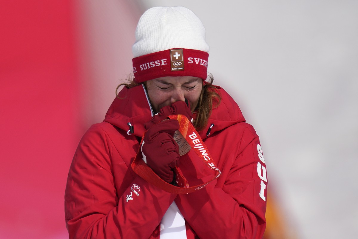 Michelle Gisin, of Switzerland, reacts during the medal ceremony after winning the bronze medal in the women's super-G at the 2022 Winter Olympics, Friday, Feb. 11, 2022, in the Yanqing district  ...