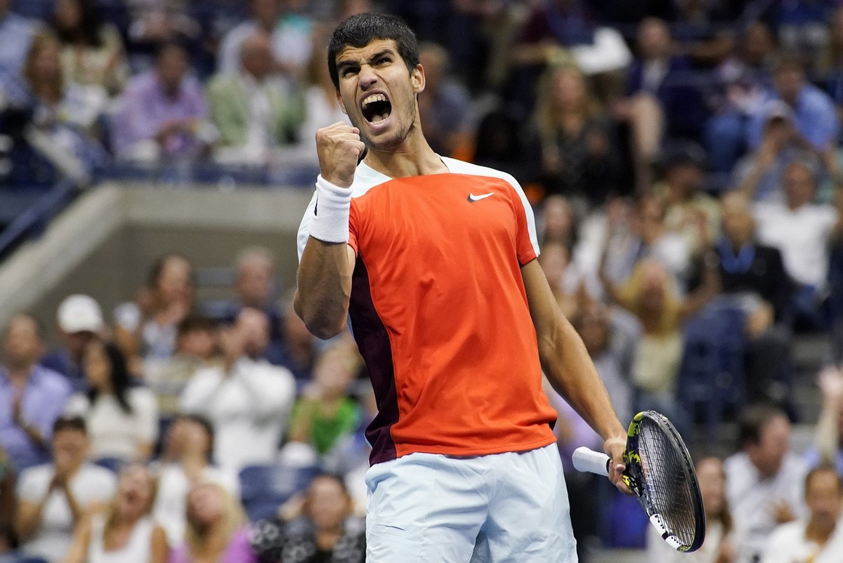 Carlos Alcaraz, of Spain, reacts after scoring a point against Casper Ruud, of Norway, during the men's singles final of the U.S. Open tennis championships, Sunday, Sept. 11, 2022, in New York. ( ...