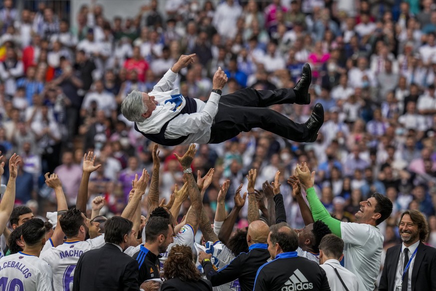 Real Madrid players lift Real Madrid&#039;s head coach Carlo Ancelotti to celebrate the team&#039;s La Liga title after a Spanish La Liga soccer match between Real Madrid and Espanyol at the Santiago  ...