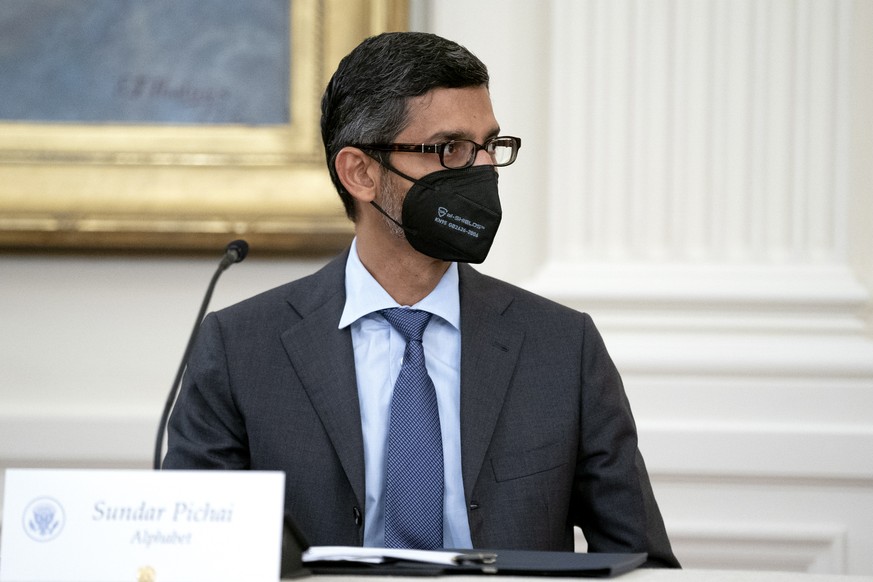 epa09429386 Sundar Pichai, chief executive officer of Alphabet Inc., attends a meeting with US President Joe Biden, not pictured, in the East Room of the White House in Washington, DC, USA, 25 August  ...