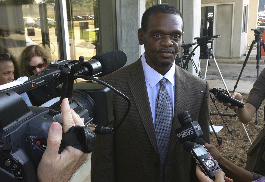 FILE - In this Sept. 3, 2014 file photo, Henry McCollum walks out of prison after being released from Central Prison in Raleigh, N.C. Lawyers representing two former North Carolina sheriff