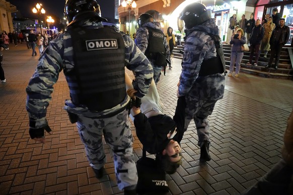 FILE - Riot police detain a demonstrator during a protest against mobilization in Moscow, Russia, Wednesday, Sept. 21, 2022. Russian President Vladimir Putin has ordered a partial mobilization of rese ...