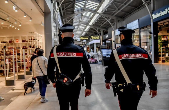 Carabinieri officers patrolled the mall the day after five people were stabbed and one killed after a man grabbed a knife from a supermarket shelf in Assago, on the outskirts of Milan, Italy.