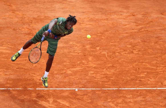 epa04706900 Gael Monfils of France serves the ball to Roger Federer of Switzerland during their third round match at the Monte-Carlo Rolex Masters tennis tournament in Roquebrune Cap Martin, France, 1 ...