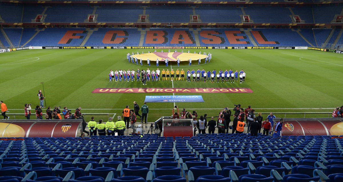 The teams in the empty stadium prior to the UEFA Europa League quarter final first leg soccer match between Switzerland's FC Basel 1893 and Spain's Valencia CF behind closed doors at the St. ...