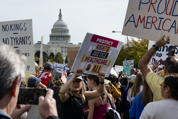 epa12463246 People fill Pennsylvania Avenue, with the US Capitol in the background, during the &#039;No Kings&#039; protest in Washington, DC, USA, 18 October 2025. The protest is part of a nationwide ...