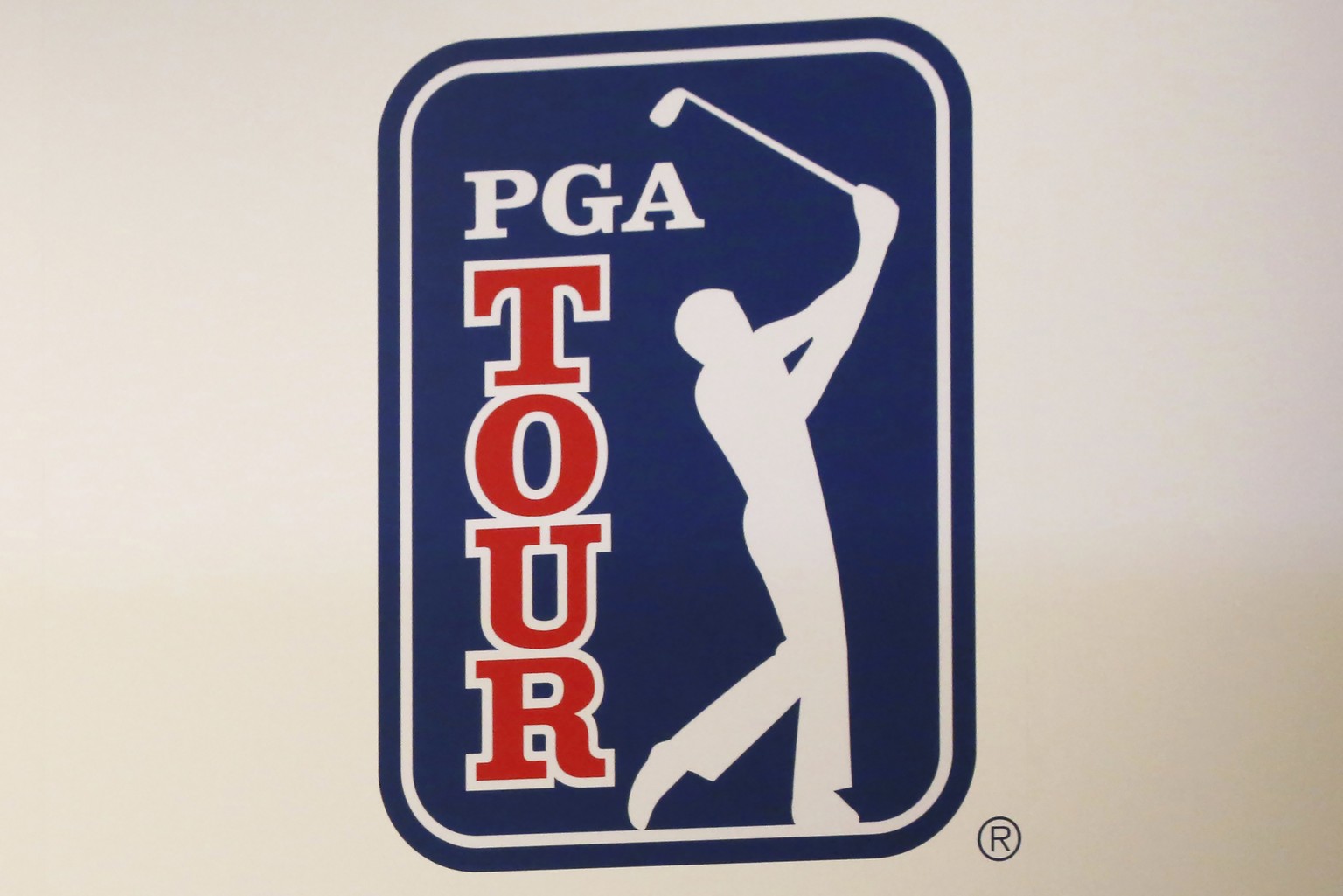 FILE - The PGA Tour logo is shown during a press conference in Tokyo, Nov. 20, 2018. The most disruptive year in golf ended Tuesday, June 6, 2023, when the PGA Tour and European tour agreed to a merge ...