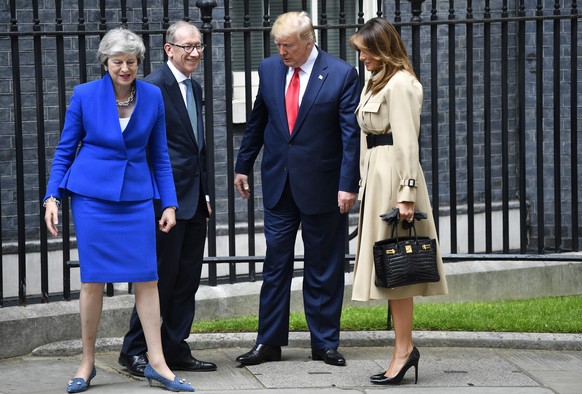 epa07624434 US President Donald J. Trump (2-R) and his wife Melania Trump (R) are welcomed by Britain&#039;s Prime Minister Theresa May (L) and her husband Philip May (2-L) at her official residence a ...