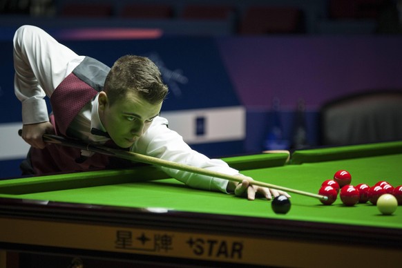 SHANGHAI, CHINA - NOVEMBER 13: Alexander Ursenbacher of Switzerland plays a shot during the qualifying match against John Higgins of Scotland on day one of 2017 Shanghai Masters at Shanghai Grand Stag ...