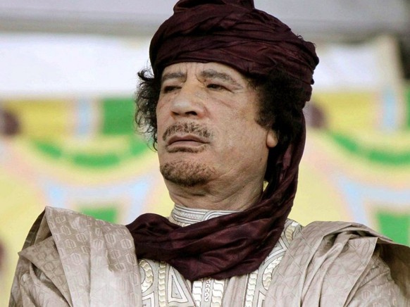 epa03728250 (FILE) A file photograph dated 06 October 2009, shows Muammar al-Gaddafi, leader of Libya, at the 50th anniversary of the founding of the officers group that mounted the Libyan Revolution  ...