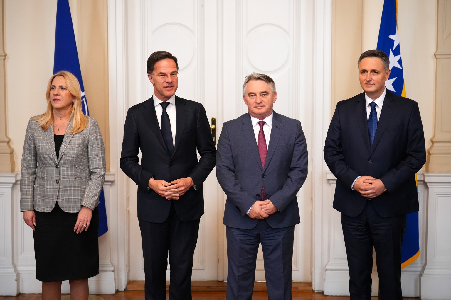 epa11953443 Members of the tripartite Presidency of Bosnia and Herzegovina, Zeljko Komsic (C-R), Denis Becirovic (R), and Zeljka Cvijanovic (L), pose for a photo with NATO Secretary General Mark Rutte ...