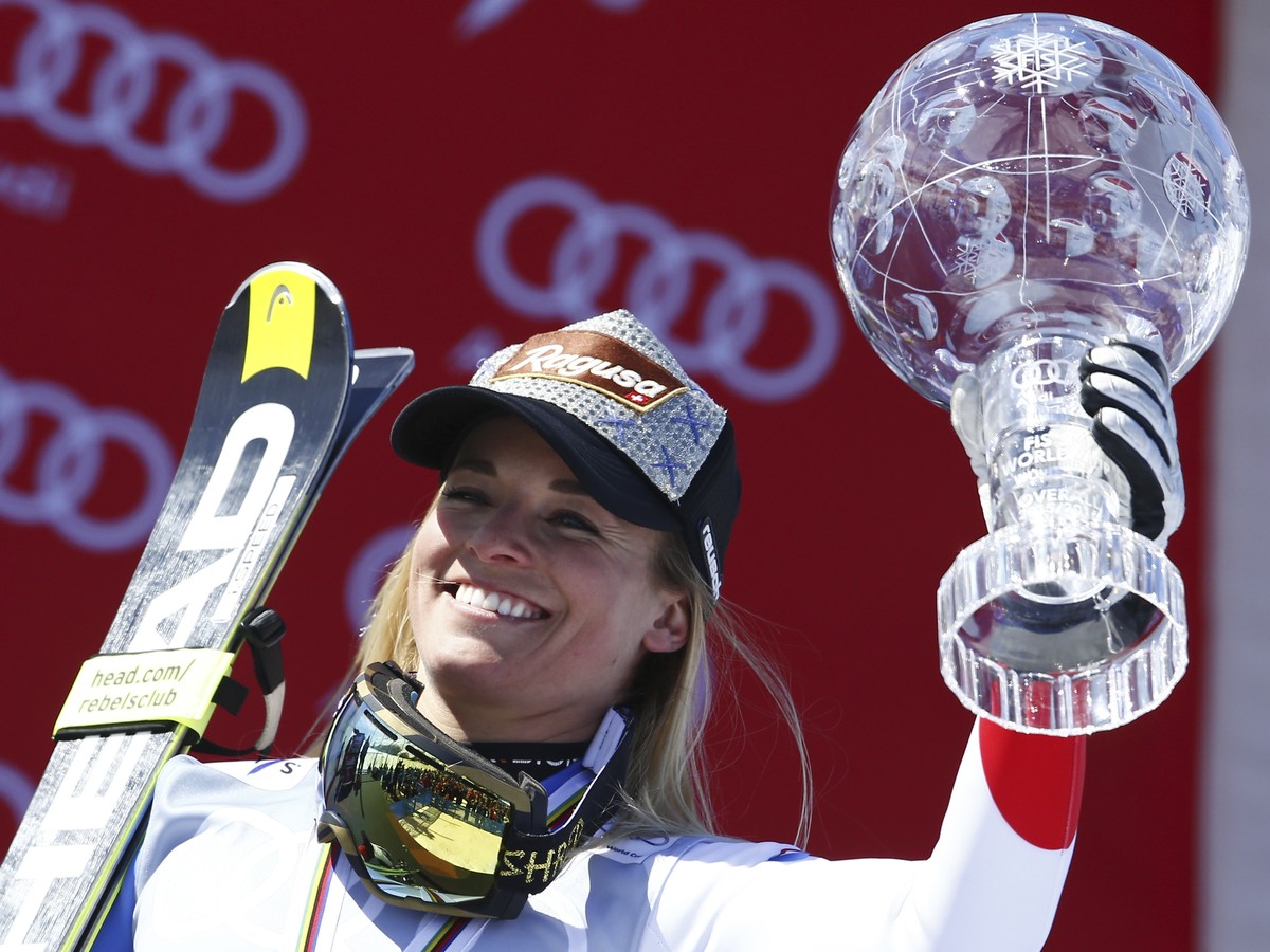 FILE - In this March 20, 2016 file photo Lara Gut of Switzerland holds the crystal globe trophy of the women's overall title at the alpine ski World Cup finals in St. Moritz, Switzerland. The fir ...