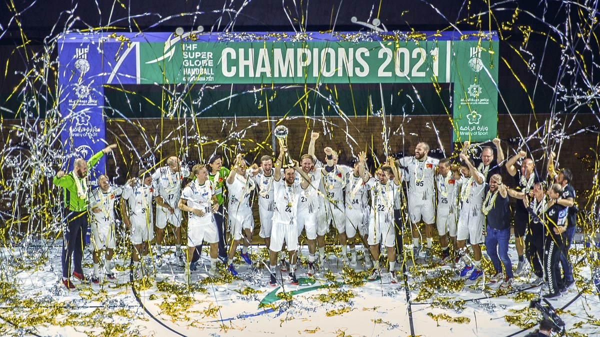 Magdeburg's platers celebrate after they win against Barcelona and win the 2021 edition of the IHF Men's Super Globe at King Abdullah Sports City in Jeddah, Saudi Arabia, Saturday, Oct. 9, 2 ...