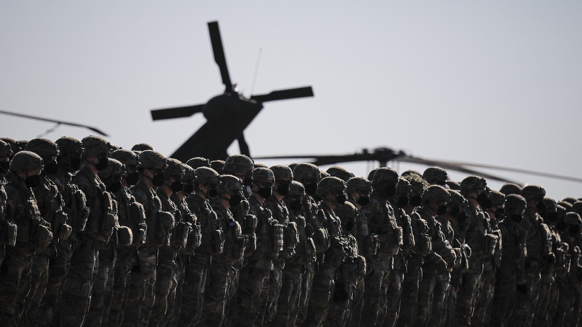 US soldiers line up during the visit of NATO Secretary General Jens Stoltenberg at the Mihail Kogalniceanu airbase, near the Black Sea port city of Constanta, eastern Romania, Friday, Feb. 11, 2022. S ...