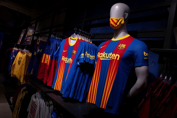 epa08966920 View of a FC Barcelona's jersey at a store in Barcelona, Spain, 26 January 2021. The jersey is a special edition for the upcoming 'clasico' Spanish LaLiga soccer match between FC Barcelona ...