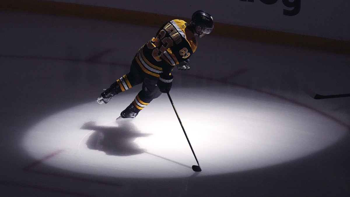Boston Bruins left wing Brad Marchand (63) warms up prior to the first period of an NHL hockey game against the Minnesota Wild, Tuesday, Feb. 4, 2025, in Boston. (AP Photo/Charles Krupa)