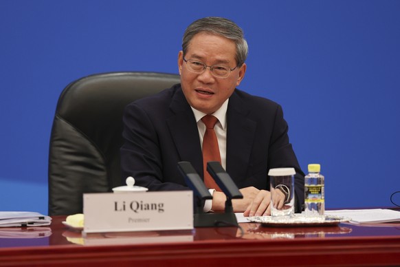 epa12956239 Chinese Premier Li Qiang meets with US business representatives, at the Great Hall of the People in Beijing, China, 14 May 2026. US President Trump is in Beijing for a high-stakes state vi ...