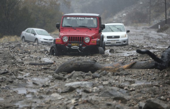 A mudslide trapped several vehicles along Valley of the Falls Drive in Forest Falls in San Bernardino County, Calif., on Thursday, Nov. 29, 2018. Forecasters say the weather system that has been raini ...