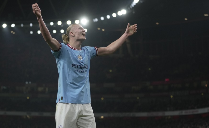 Manchester City&#039;s Erling Haaland celebrates after scoring his side&#039;s third goal during the English Premier League soccer match between Arsenal and Manchester City at the Emirates stadium in  ...