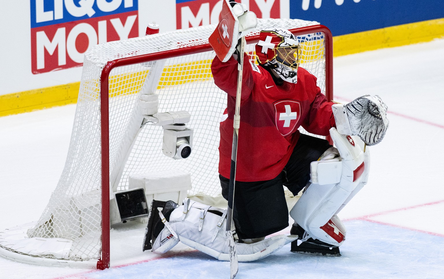 Switzerland&#039;s goaltender Leonardo Genoni reacts during the Ice Hockey World Championship group A preliminary round match between Switzerland and Slovakia in Helsinki at the Ice Hockey Hall, Finla ...