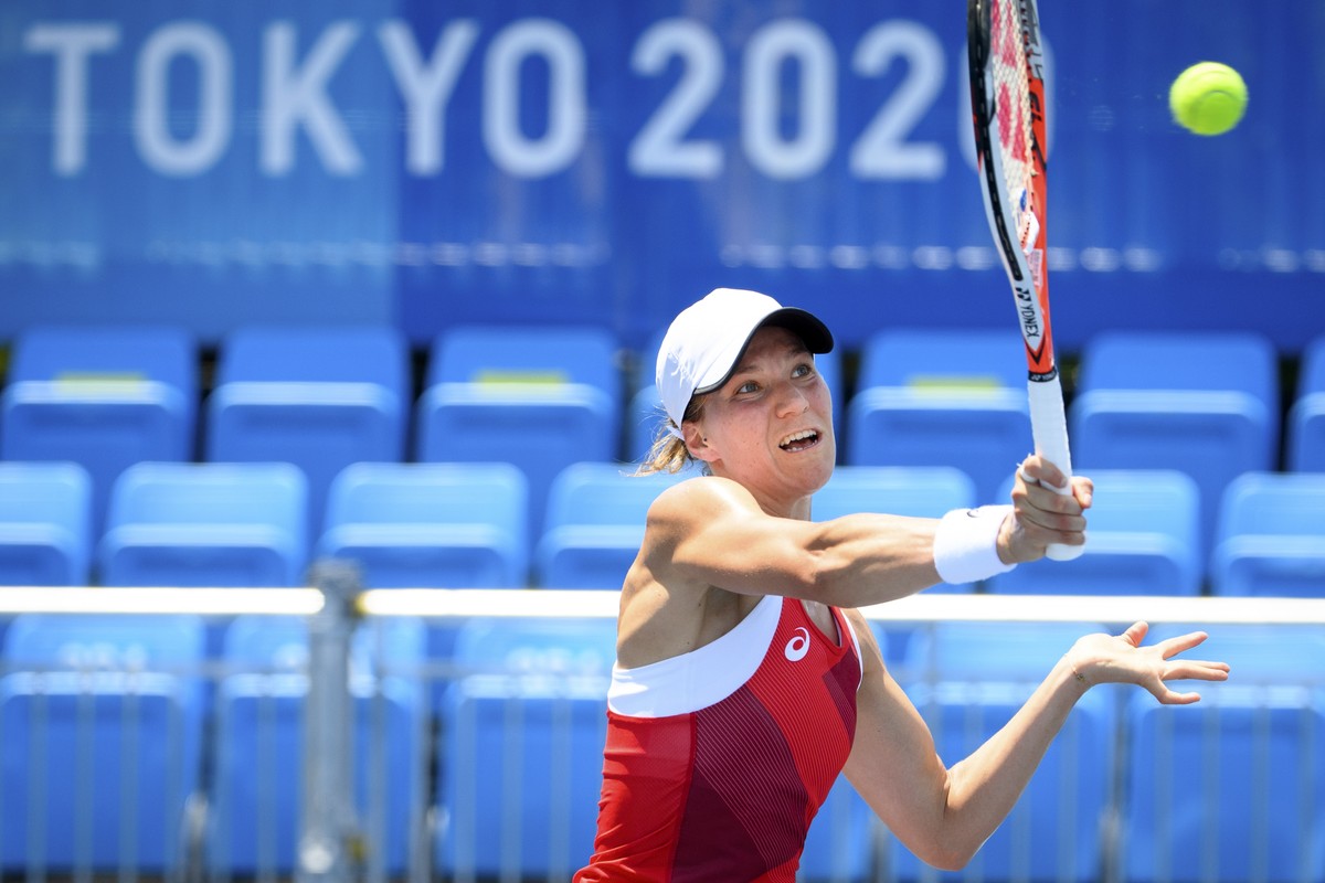 epa09360772 Viktorija Golubic of Switzerland returns a ball to Maria Camila Osorio Serrano of Colombia during the women's single tennis first round match at the 2020 Tokyo Summer Olympics at the  ...