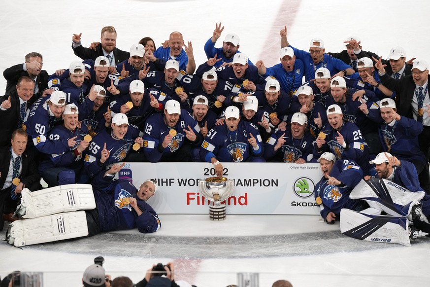 Team Finland poses for a photo after the Hockey World Championship final match between Finland and Canada, Sunday May 29, 2022, in Tampere, Finland. Finland won 4-3 in overtime. (AP Photo/Martin Meiss ...