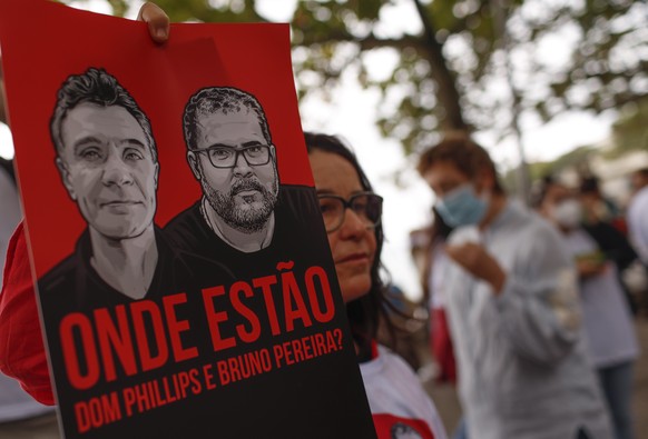 Brazilian actress Lucelia Santos takes holds a poster with the images of British journalist Dom Phillips, left, and expert on indigenous affairs Bruno Araujo Pereira following their disappearance in t ...