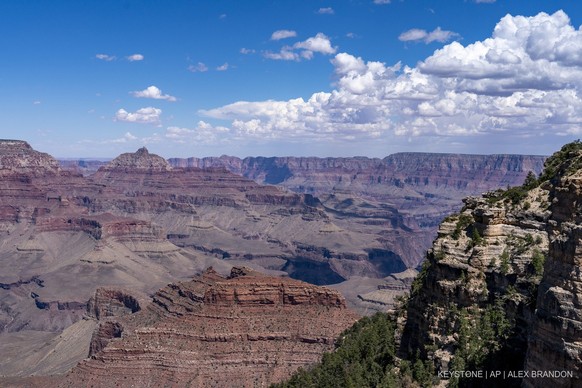 Clouds pass over the South Rim of Grand Canyon National Park in Grand Canyon Village, Ariz., Tuesday, Aug. 8, 2023. (AP Photo/Alex Brandon)