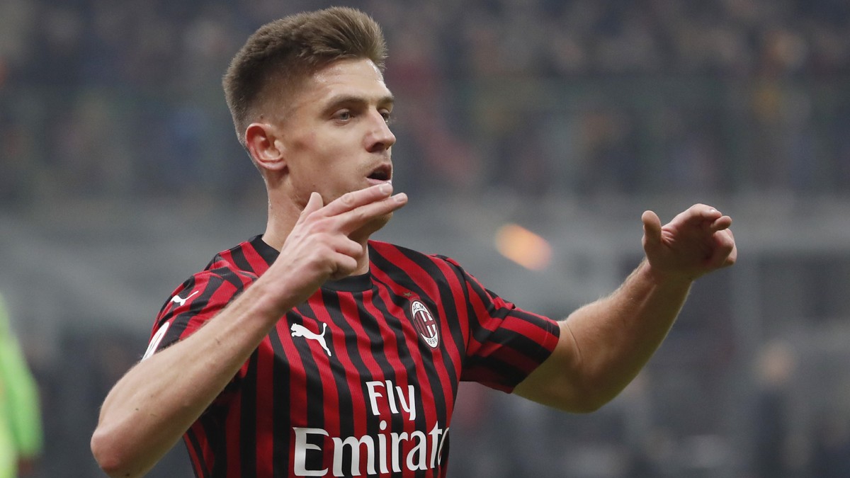 AC Milan's Krzysztof Piatek celebrates after scoring his side's opening goal during an Italian Cup soccer match between AC Milan and Spal at the San Siro stadium, in Milan, Italy, Wednesday, ...