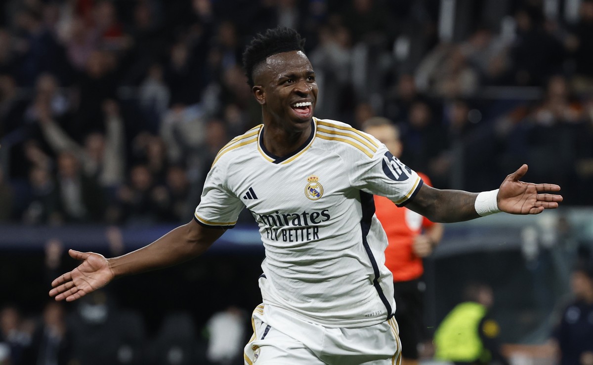 epa11202950 Real Madrid's Vinicius Junior celebrates after scoring the 1-0 goal during the UEFA Champions League round of 16 second leg soccer match between Real Madrid and RB Leipzig in Madrid,  ...