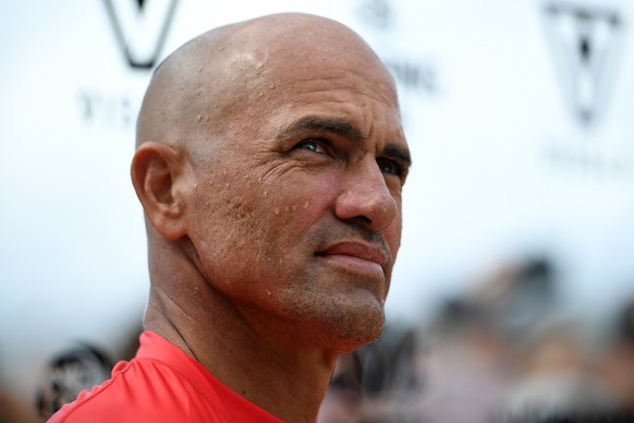 epa07449428 United States surfer Kelly Slater walks up the beach after competing in his heat at the Sydney Surf Pro at Manly in Sydney, Australia, 20 March 2019. EPA/DAN HIMBRECHTS AUSTRALIA AND NEW Z ...