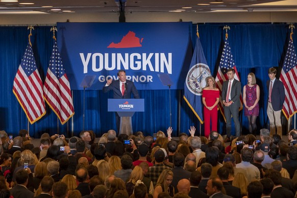 epa09560805 Virginia Republican gubernatorial candidate Glenn Youngkin (L) delivers his victory speech at the Westfields Marriott Hotel in Chantilly, Virgina, USA, 03 November 2021. Youngkin ran again ...