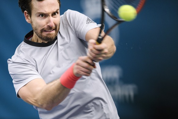 Ernests Gulbis of Latvia returns to John Isner of US, during their semi-final of the Stockholm Open tennis tournament at the Royal Tennis Hall in Stockholm, Sweden, Saturday Oct. 20, 2018. (Erik Siman ...