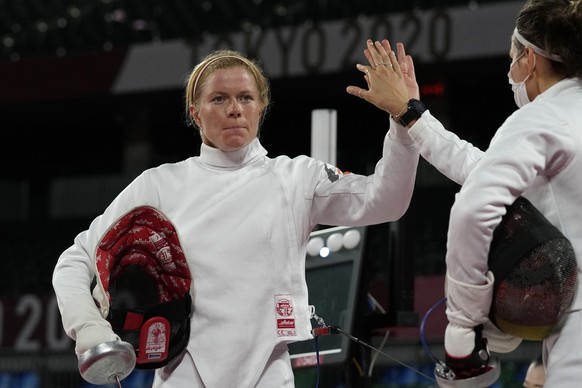 Annika Schleu of Germany celebrates with Rebecca Langrehr of Germany winning a point against Natalya Coyle of Irland in the fencing portion of the women&#039;s modern pentathlon at the 2020 Summer Oly ...
