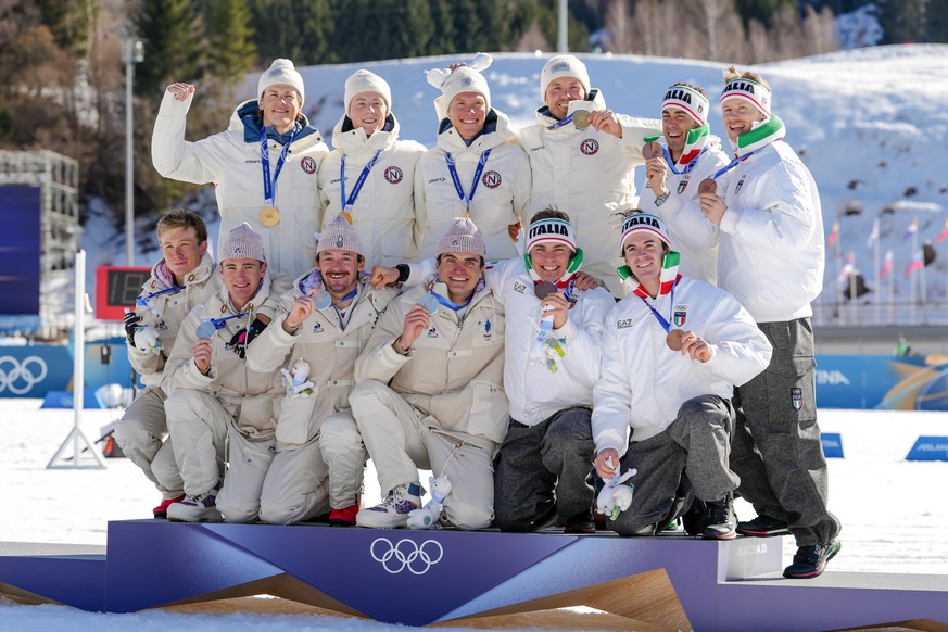 Silver medalists France, gold medalists Norway and bronze medalists Italy pose on the podium of the cross country skiing men's 4 x 7.5km relay at the 2026 Winter Olympics, in Tesero, Italy, Sunda ...
