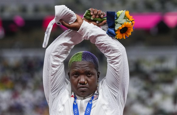 Raven Saunders, of the United States, poses with her silver medal on women&#039;s shot put at the 2020 Summer Olympics, Sunday, Aug. 1, 2021, in Tokyo, Japan. During the photo op at her medals ceremon ...