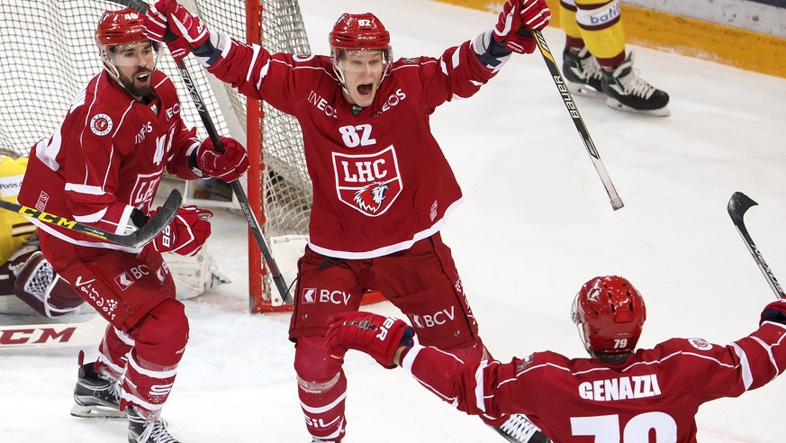 Lausanne&#039;s center Etienne Froidevaux, left, celebrates his goal with teammates Lausanne&#039;s forward Harri Pesonen, of Finland, center, and defender Joel Genazzi, right, after scoring the 3:2,  ...