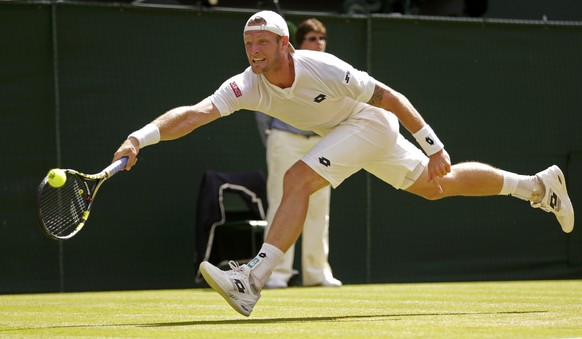 Samuel Groth of Australia hits a shot during his match against Roger Federer of Switzerland at the Wimbledon Tennis Championships in London, July 4, 2015. REUTERS/Henry Browne