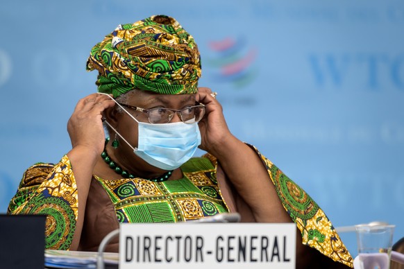 New Director-General of the World Trade Organisation Ngozi Okonjo-Iweala adjustes her facemask as a preventive measure against the Covid-19 coronavirus during a session of the WTO General Council upon ...