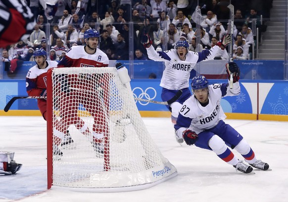 Cho Minho (87), of South Korea, celebrates after scoring a goal against the Czech Republic during the first period of the preliminary round of the men&#039;s hockey game at the 2018 Winter Olympics in ...
