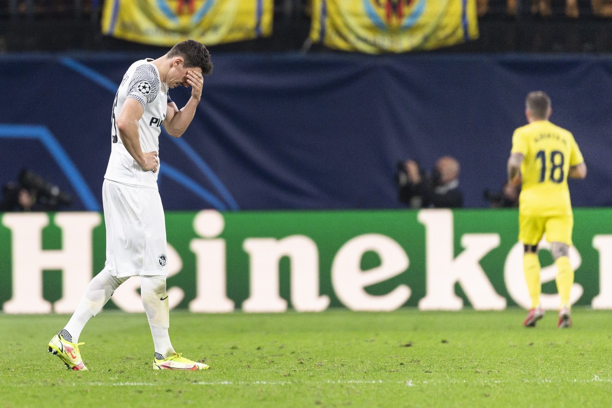 Young Boys' Christian Fassnacht, left, shows disappointment after Villareal's second goal, during the UEFA Champions League group F soccer match between Villarreal CF of Spain and BSC Young  ...
