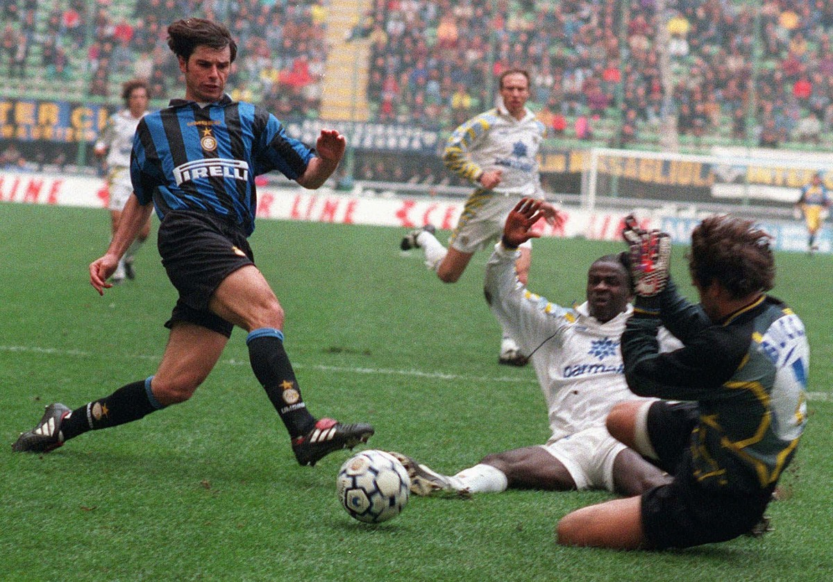 Inter Milan's Swiss forward Ciriaco Sforza kicks the ball as Parma's goalie Luca Bucci tries to stop him, during their Italian first division soccer game, at the Milan San Siro stadium, Sund ...